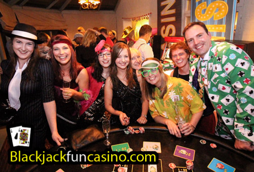 People having fun at the casino tables for a fancy dress party