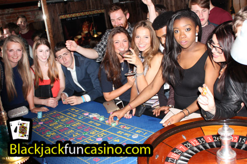 Lots of people having a great time at the roulette table