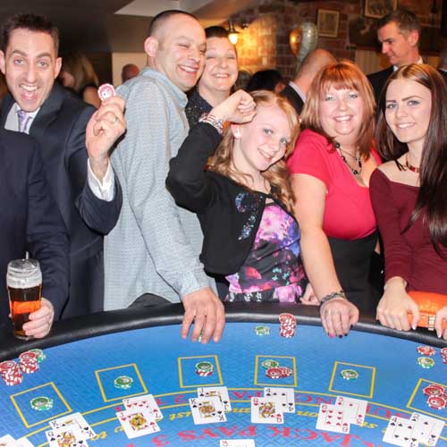 Fun Casino Hire in Derby for Parties and Events Guests enjoying blackjack casino games at a fun casino night in Derby
